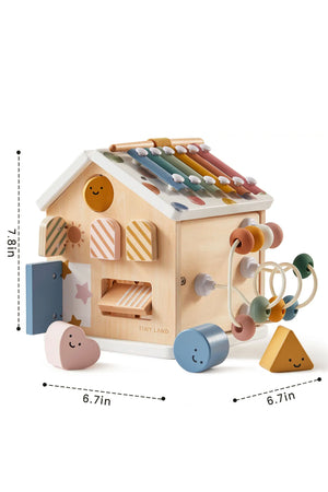 A colorful wooden activity cube from Tiny Land features various shapes, a xylophone, and interactive elements for toddlers.