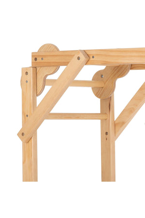 Natural wood finish beams and curved connectors form part of a foldable jungle gym, showcasing a sturdy, eco-friendly design ideal for indoor play. Perfect for toddlers and kids.