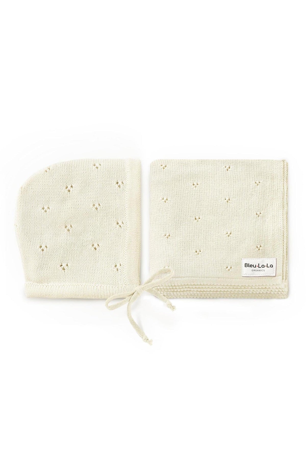 Cream-colored organic pointelle swaddle blanket and matching hat set with delicate patterns, labeled Bleu La La Organics.