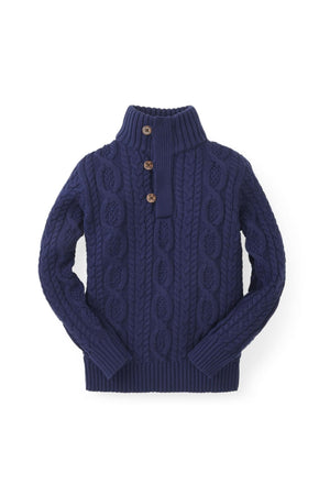 Navy blue mock neck cable sweater made from 100% organic cotton, featuring faux leather buttons and ribbed cuffs.