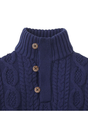 Navy blue organic cotton mock neck sweater featuring a cable knit design and faux leather buttons. Ideal for baby boys.
