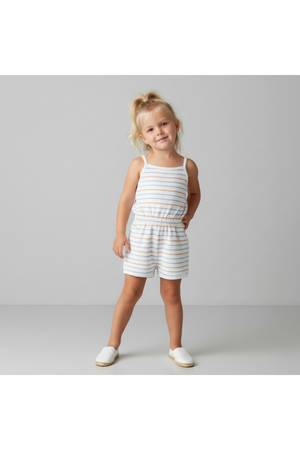 A young girl poses wearing a soft, organic cotton tank romper featuring blue and orange stripes. The romper has a comfortable, pull-on style, perfect for warm-weather activities.