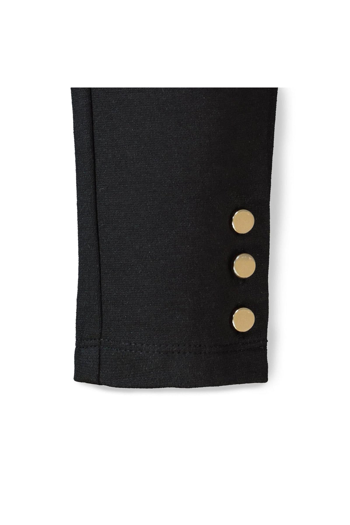 Close-up of a black ponte pant cuff featuring three gold button accents. Made from organic cotton, this stylish piece is ideal for toddlers and girls seeking comfort and elegance.
