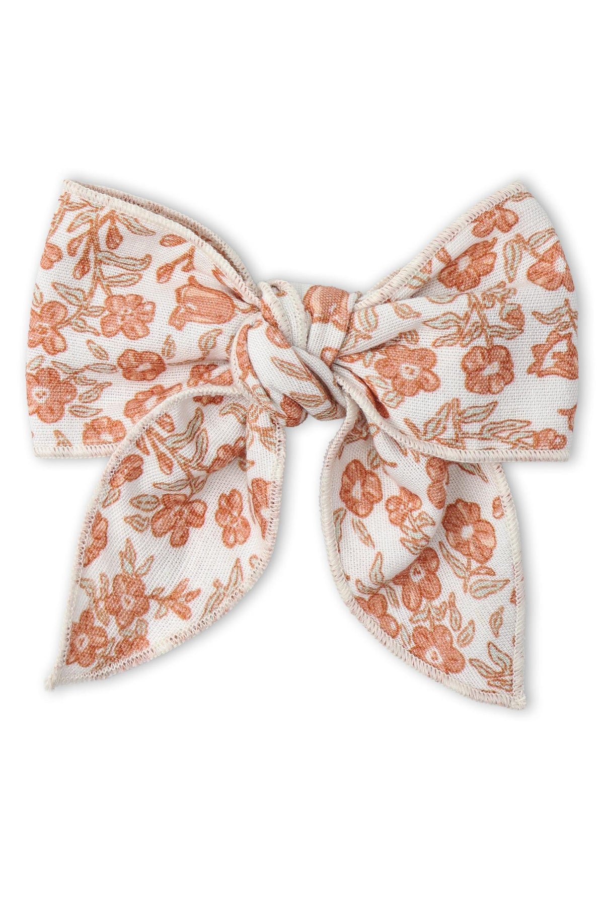 A charming hair bow clip featuring a floral design in earthy sienna tones on a white background. Made from organic materials, it’s a delightful accessory for children’s outfits.