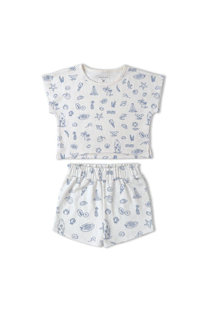 Organic cotton drop shoulder tee and shorts set featuring a light, beach-themed print in soft blue tones.