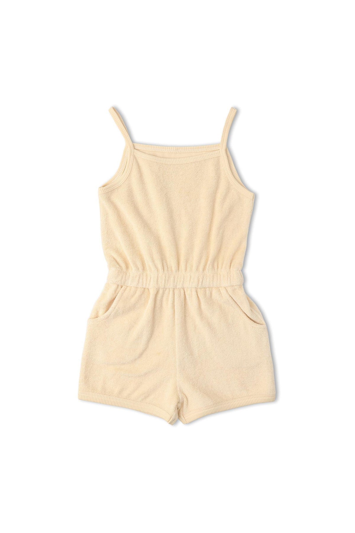Organic tank romper in a soft butter yellow shade, made from breathable terry fabric. This comfy one-piece features adjustable straps and side pockets, perfect for warm-weather outings.