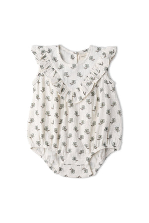 Lightweight organic cotton romper featuring a white background with a delicate floral print and ruffle detailing along the shoulders, perfect for keeping little ones comfortable and stylish.