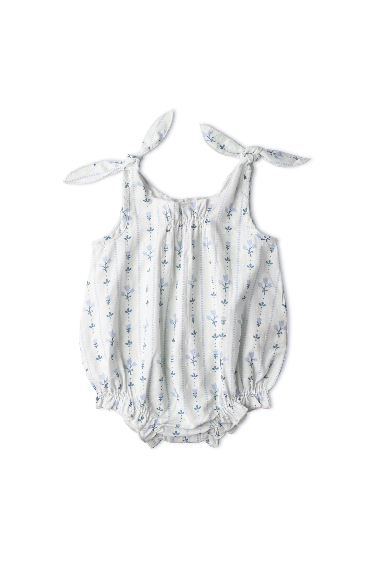 Organic cotton bubble romper featuring a blue vines print, adjustable tie shoulder straps, and a relaxed silhouette. Designed for comfort and playful style for young children.