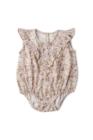 Pastel floral-patterned organic cotton sleeveless ruffle bubble romper with delicate ruffles, featuring a soft and comfortable design for young children. Ideal for warm weather play and outings.