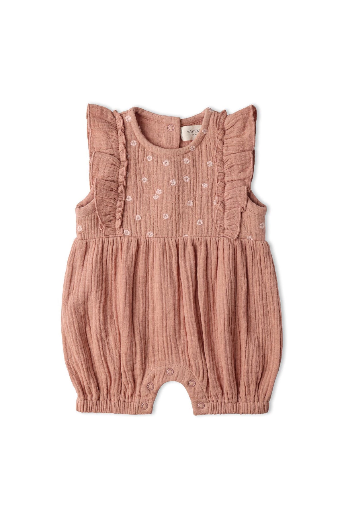 Organic embroidered ruffle romper in a soft clay color, made from lightweight organic muslin cotton. Features delicate ruffles and subtle embroidery, perfect for warm-weather days.