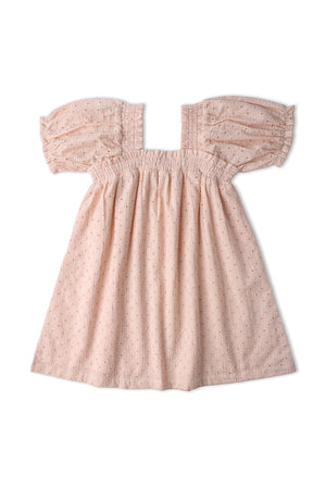A blush eyelet dress featuring delicate embroidery and playful bubble sleeves. Made from organic cotton, this lightweight garment is designed for comfort and breathability, perfect for warm weather.