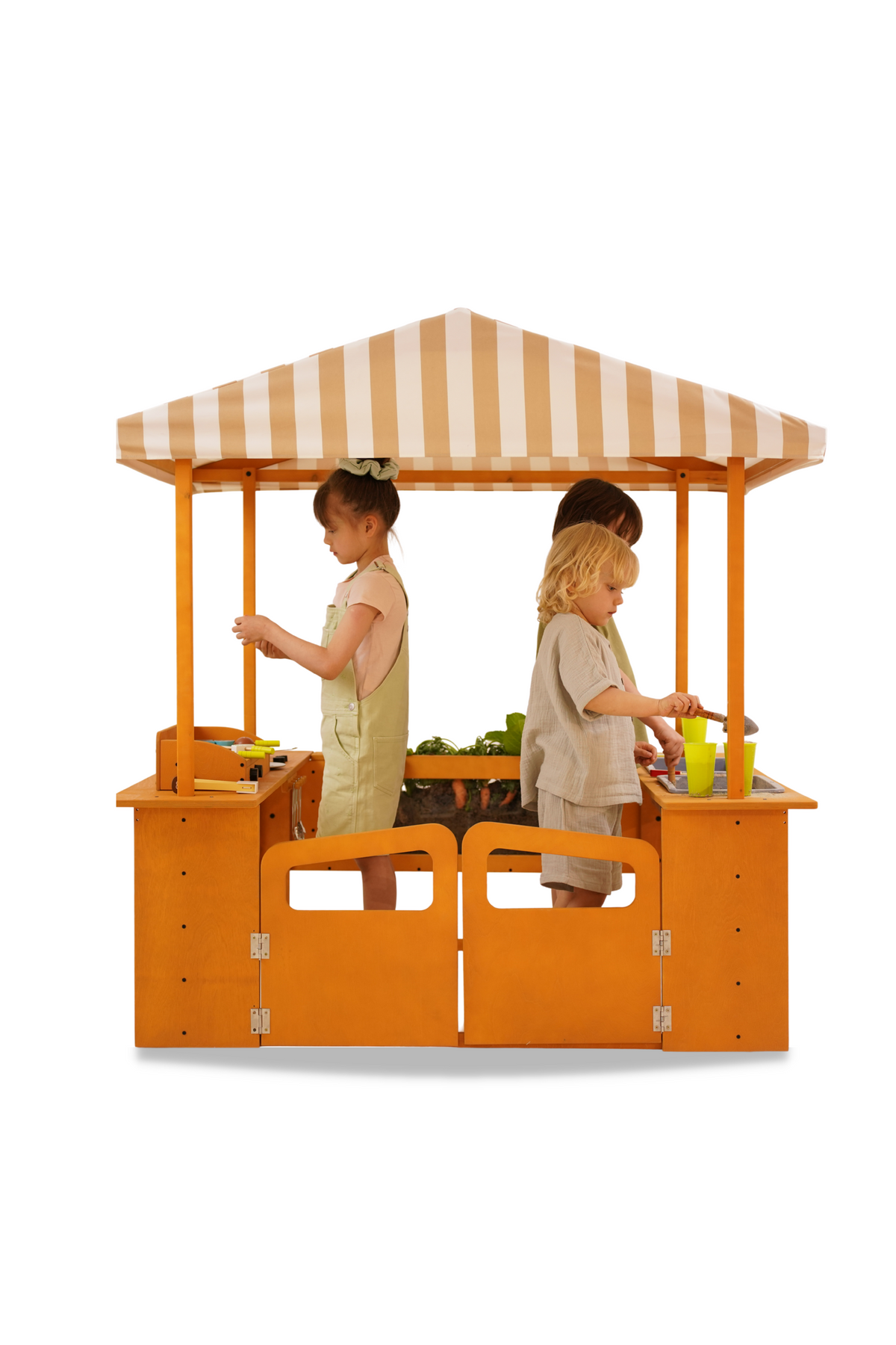 Two children play at a wooden market stand with a striped canopy, engaging in imaginative play with colorful pretend food items. The structure features eco-friendly materials, promoting creative outdoor activities.