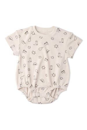 Light beige organic cotton bubble romper featuring playful cowboy-themed prints, including boots and hats. Ideal for comfortable, adventurous wear for babies, promoting sustainability and eco-friendly fashion.