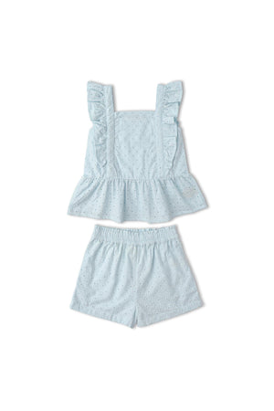 Light blue organic cotton eyelet top with ruffled straps and matching shorts, featuring delicate cutwork details. This charming set is perfect for warm-weather outings and sustainable fashion choices.