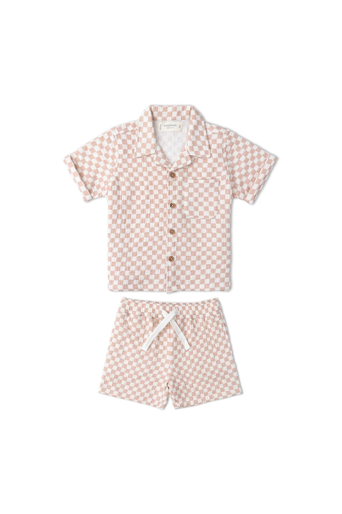 A lightweight, organic cotton shirt and shorts set features a brick check pattern in soft peach and cream tones.