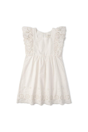 An ivory organic cotton dress featuring delicate eyelet detailing and flutter sleeves. This light, airy dress is designed for comfort and play, perfect for young children.