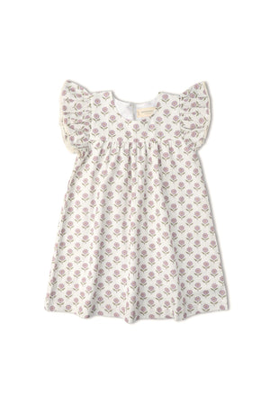 A short sleeve flutter dress in soft white fabric adorned with a lavender floral print. This organic cotton dress is suitable for young children, promoting comfort and style.