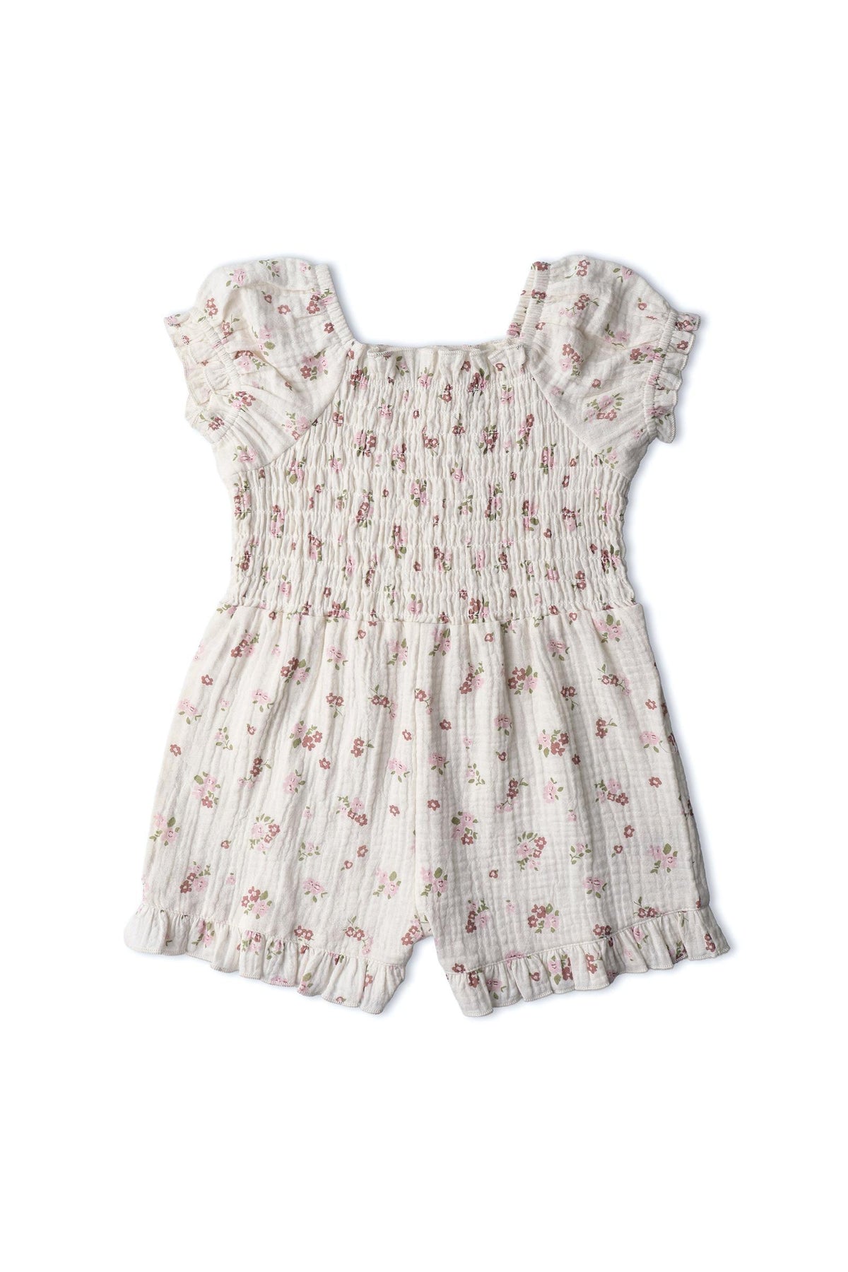 Organic cotton blush floral jumpsuit featuring soft smocking, ruffled sleeves, and a lightweight muslin fabric. Ideal for warm days, it combines comfort and style for little ones.