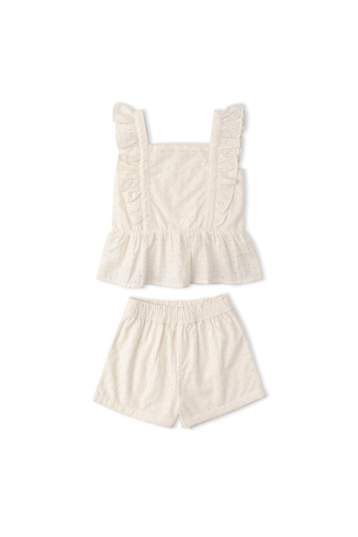 Organic cotton eyelet flutter top and shorts set in ivory, featuring delicate ruffles and intricate cutwork. Perfect for warm-weather outings, this charming outfit combines style with sustainability.