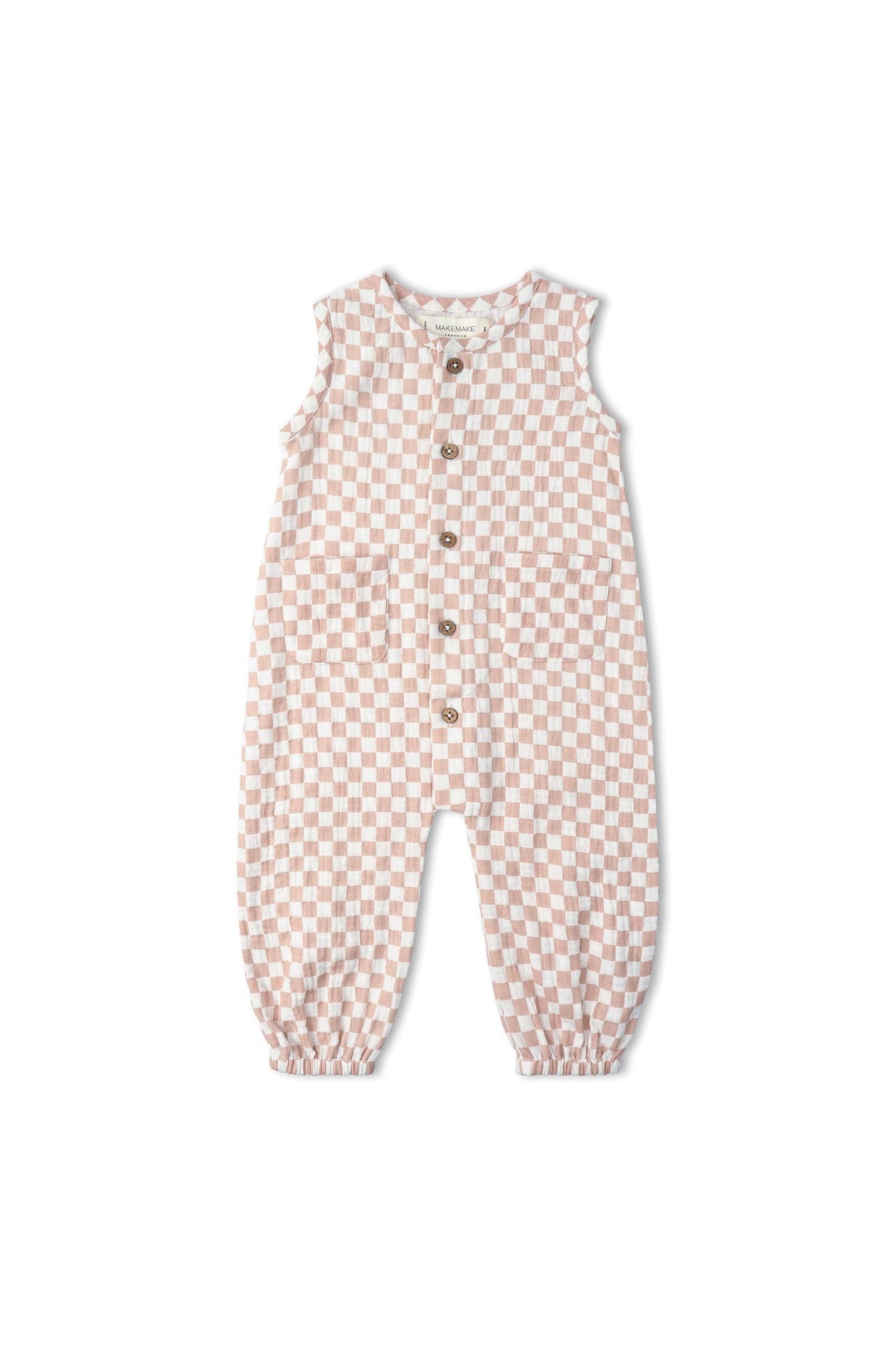 A soft muslin cotton jumpsuit in brick checks features a sleeveless design, delicate wooden buttons, and elasticized cuffs, perfect for comfortable wear and playful activities. Ideal for eco-conscious families.