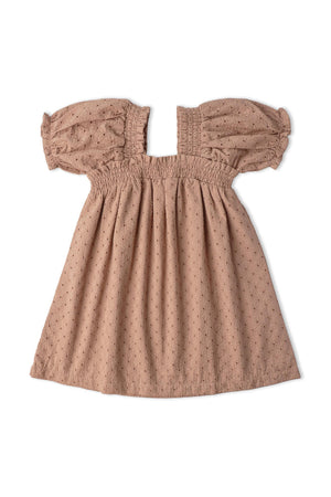 A clay-colored organic cotton dress featuring eyelet detailing and bubble sleeves. The soft, breathable fabric is perfect for warm weather, offering comfort and a stylish look for young children.