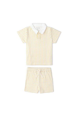A yellow and white checkered collar tee and matching shorts set made from ultra-soft organic cotton. This stylish outfit is perfect for sunny day adventures, ideal for little ones.