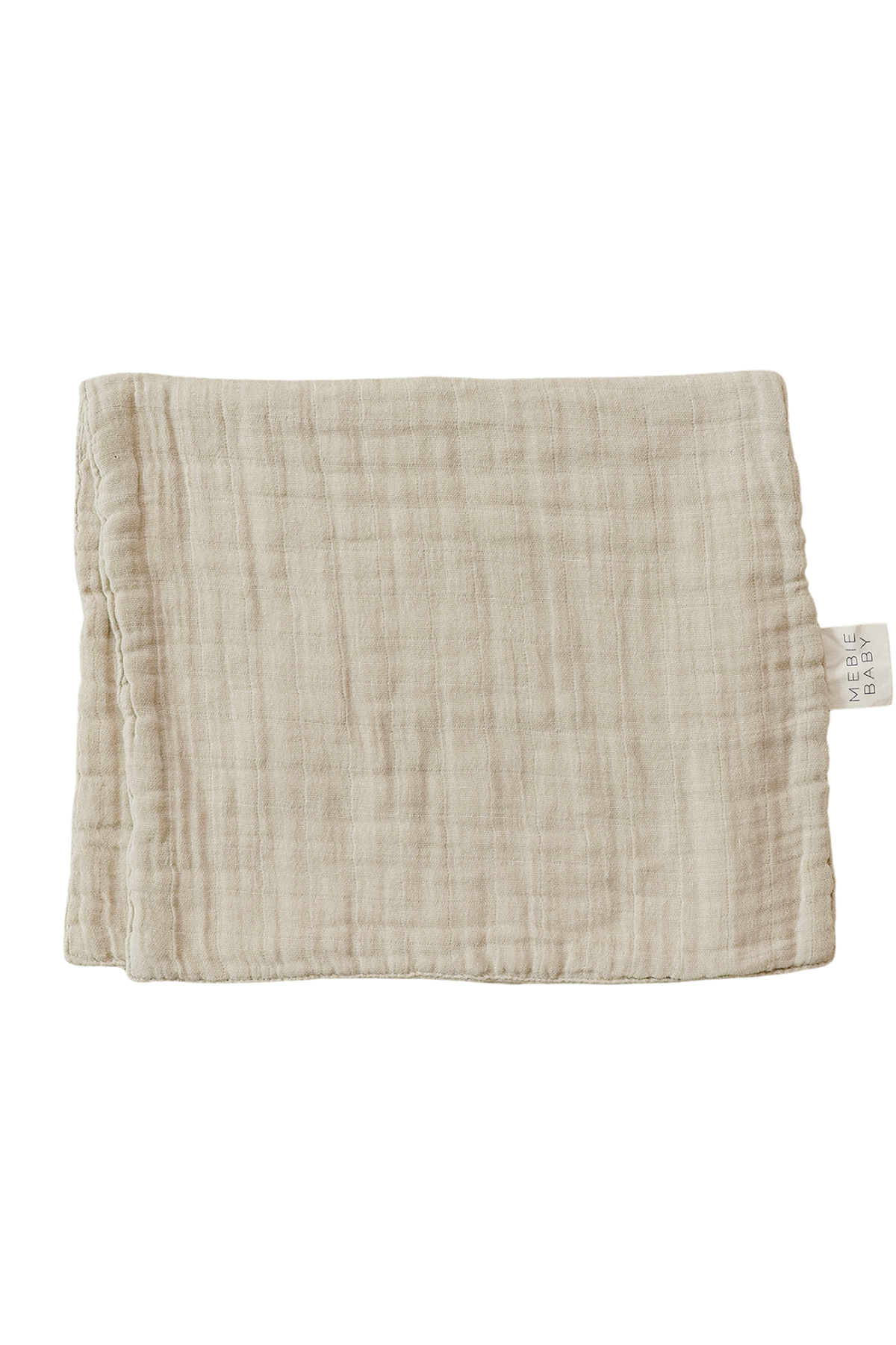 A folded oatmeal-colored muslin burp cloth made of 100% cotton, featuring a soft, textured surface and a tag labeled Mebie.