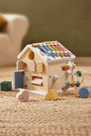 Montessori-inspired Tiny Land® wooden activity cube in pastel colors, featuring various shapes and beads for interactive play. Ideal for toddlers.