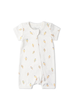 White short zip romper featuring a playful ice cream cone pattern. Made from soft, organic cotton, its designed for comfort and convenience, perfect for warm weather and active toddlers.