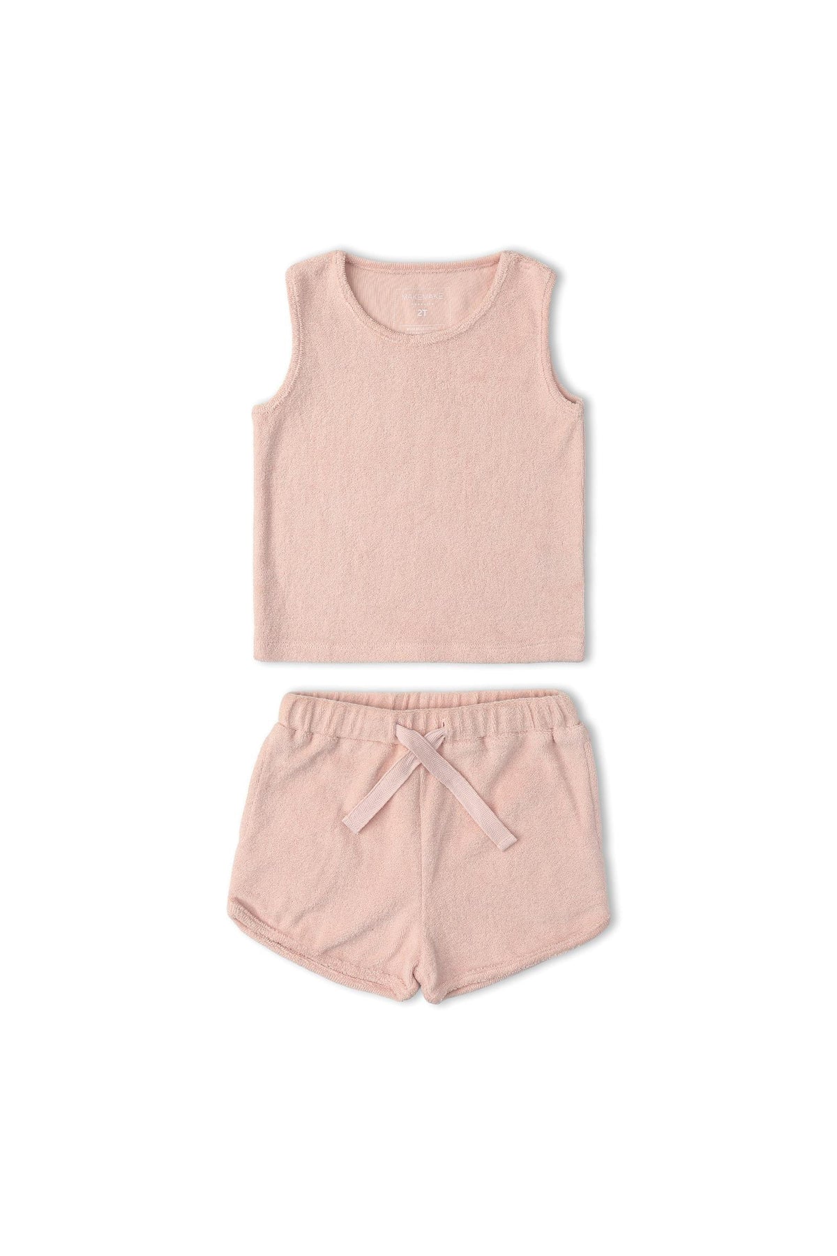 Organic cotton sleeveless tee and shorts set in soft blush, featuring a relaxed fit and towel-like texture. Ideal for comfortable, laid-back days at home or outdoors.