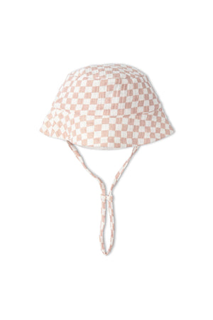 A brick check-patterned organic cotton bucket sun hat featuring a wide brim and adjustable chin straps. Ideal for sun protection and outdoor activities for children.