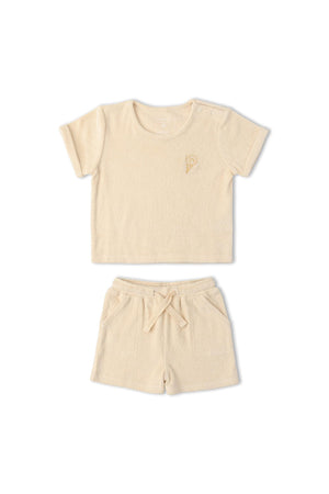 Butter yellow organic terry tee and shorts set featuring a relaxed fit and soft, breathable fabric. Ideal for summer comfort, playtime, and lounging. Perfect for eco-conscious families.