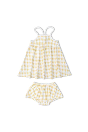 A sunny yellow and white gingham dress set featuring adjustable tie-back straps and matching bloomers. Made from soft, breathable organic cotton, perfect for children’s casual wear.