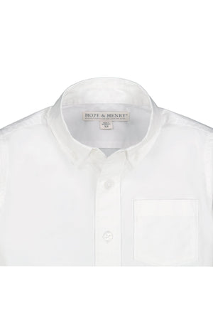 White button-down shirt featuring a classic collar and a chest pocket, made from soft organic cotton poplin. Designed by Hope & Henry for toddlers and kids, combining style with sustainability.