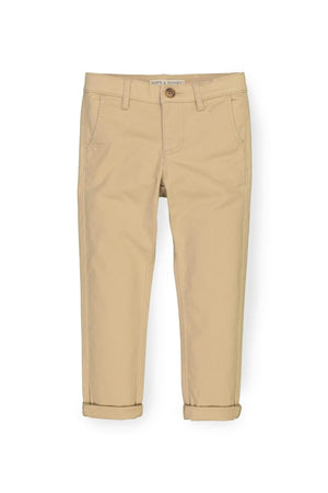 Khaki skinny chinos for boys from Hope & Henry, featuring rolled cuffs and made from organic cotton for comfort.