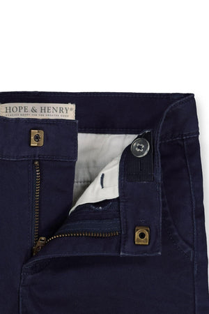 Close-up of navy organic cotton chino pants by Hope & Henry, showcasing the zipper, button closure, and inner lining details.