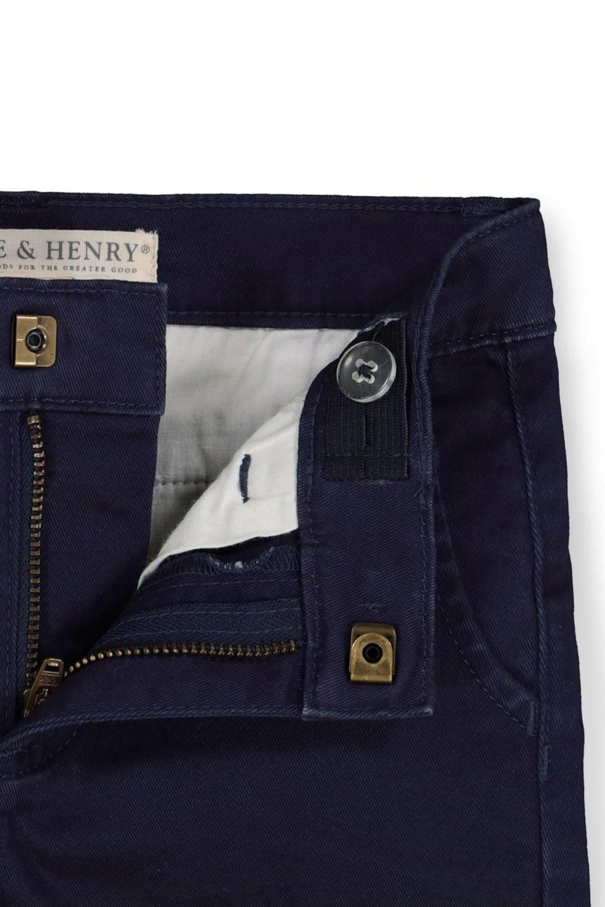 Close-up of Hope & Henry navy organic cotton twill chinos, featuring a zipper and button closure with an adjustable waistband.
