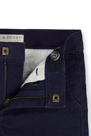 Close-up of Hope & Henry navy organic cotton twill chinos, featuring a zipper and button closure with an adjustable waistband.