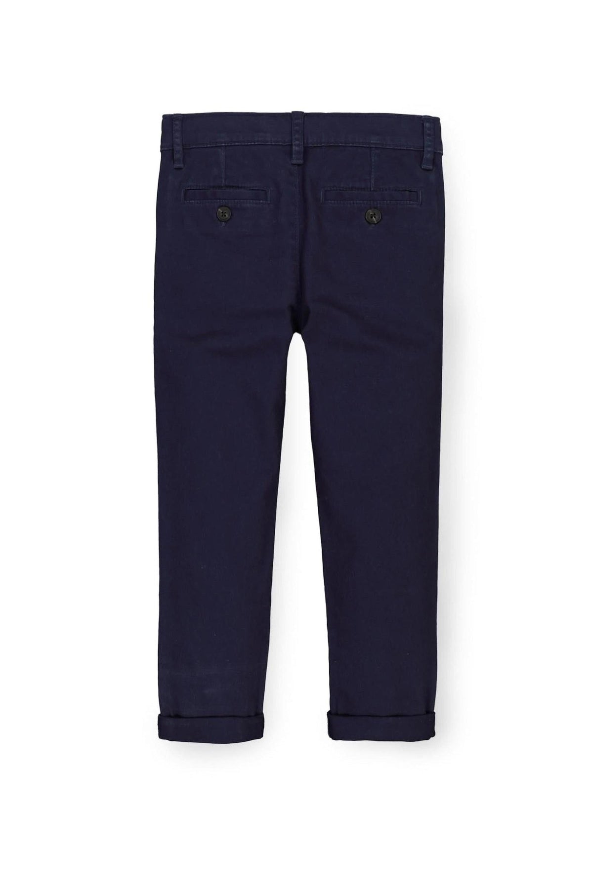 Navy blue skinny chinos made from organic cotton twill, featuring faux horn buttons and an adjustable waistband for a comfortable.