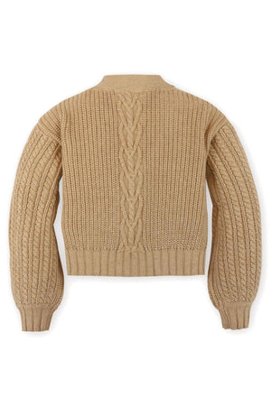 Back view of a camel-colored chunky cable cardigan made from organic cotton, featuring textured patterns and belled sleeves.