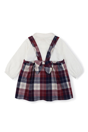 A back view of a two-piece outfit featuring a white long-sleeve bodysuit with a Peter Pan collar and a plaid jumper in berry tartan tones, designed for girls.