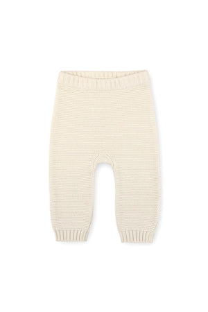 Cream-colored baby leggings made from organic cotton feature a textured knit design and elasticized waistband, ideal for comfort and style. Perfect for ages 0-24 months.