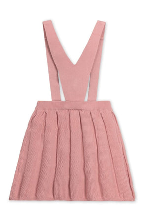 A pink pleated overall skirt with adjustable straps and a textured knit design, made from soft organic cotton for kids.