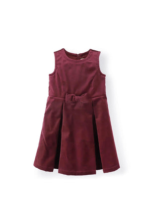 Wine red cotton jumper dress featuring a front bow detail and pleated skirt, suitable for toddlers and kids.