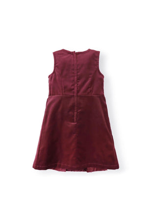 Back view of a wine red jumper dress with a pleated skirt and zipper closure, crafted from soft organic cotton.