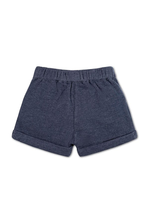 Navy blue organic cotton fleece dress shorts featuring a herringbone pattern, cuffed hem, and elastic waistband for comfort.