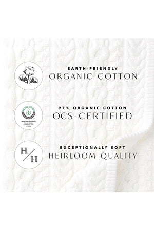 A textured white fabric displays labels indicating it is made of 97% organic cotton, highlighting its eco-friendly qualities.