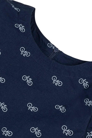 Close-up of a navy fabric featuring a playful bicycle print, with a smooth neckline and a zipper closure for easy.