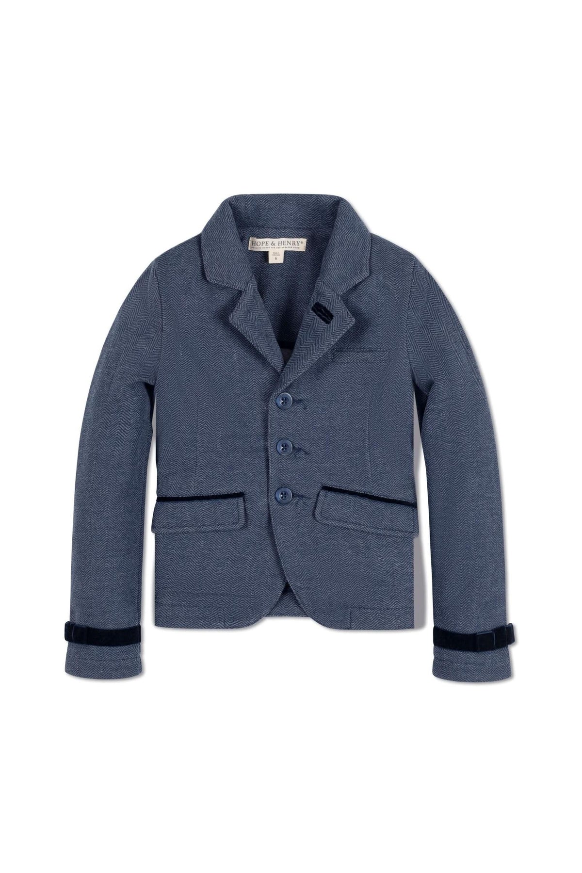 Navy blue riding blazer made from soft jacquard fleece, featuring faux suede piping and button closure. Ideal for cooler weather.