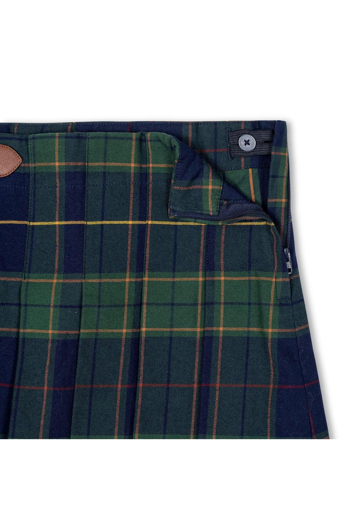 Close-up of a navy plaid skirt featuring green and yellow lines, showcasing pleats and a faux leather buckle detail.